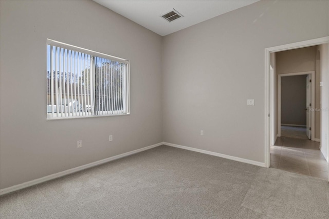 empty room with light colored carpet