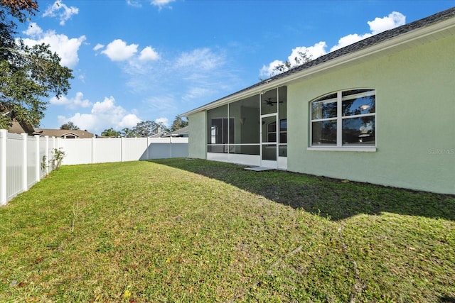 view of yard with a sunroom