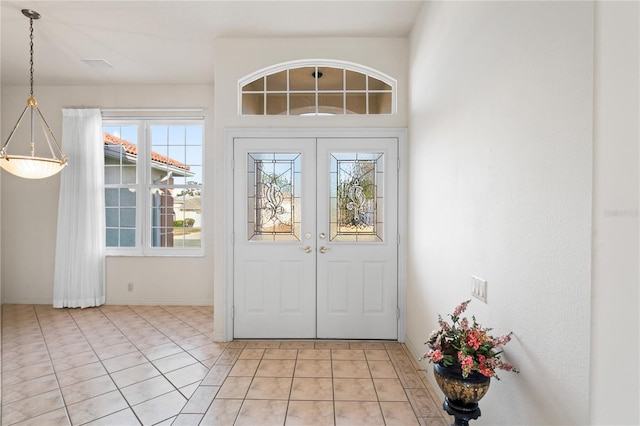 tiled entrance foyer with french doors