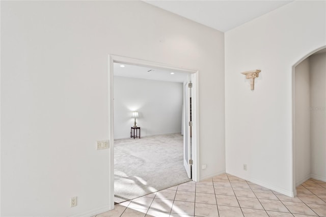 corridor with light colored carpet