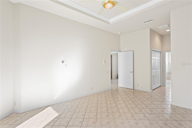 tiled spare room with ceiling fan