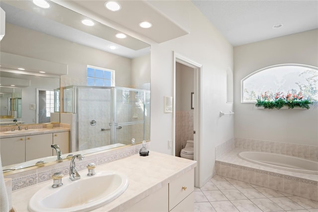 full bathroom featuring tile patterned floors, vanity, toilet, and independent shower and bath