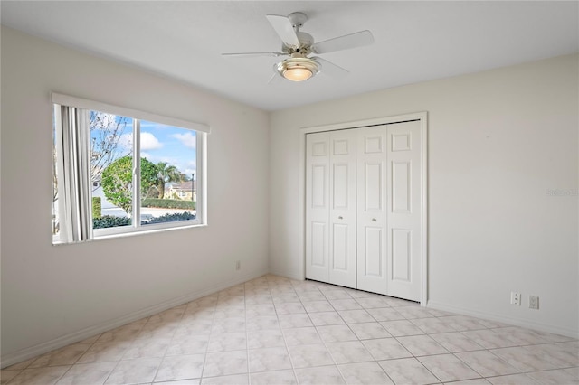 unfurnished bedroom with a closet and ceiling fan