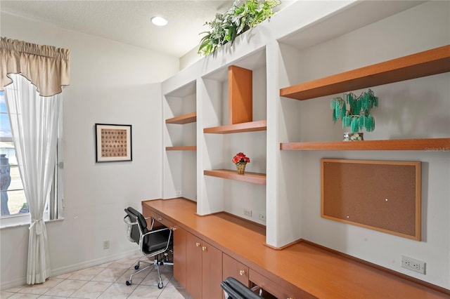 tiled office featuring built in desk