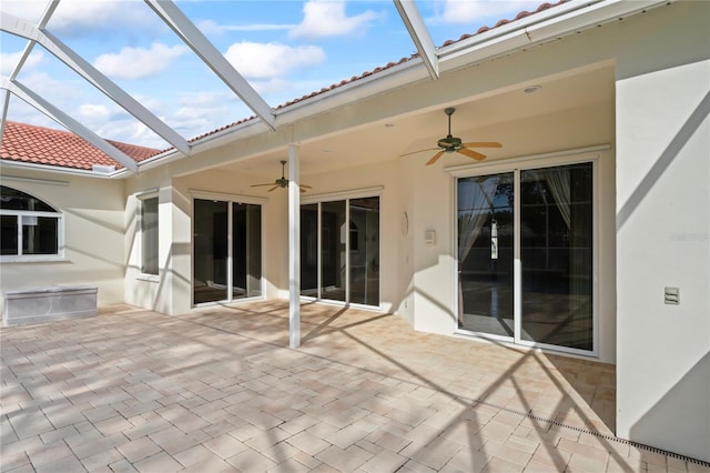 view of patio / terrace with glass enclosure and ceiling fan