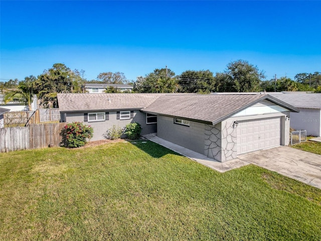 single story home featuring a garage and a front lawn