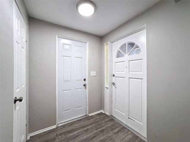 entrance foyer with dark hardwood / wood-style flooring