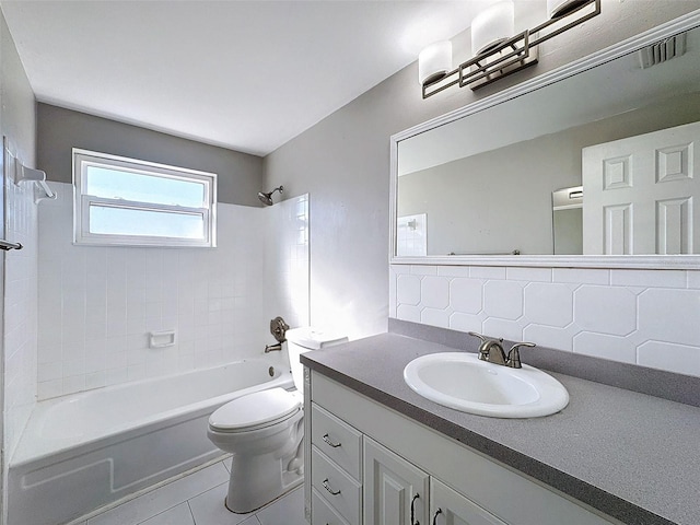 full bathroom featuring tasteful backsplash, tile patterned flooring, toilet, vanity, and tiled shower / bath