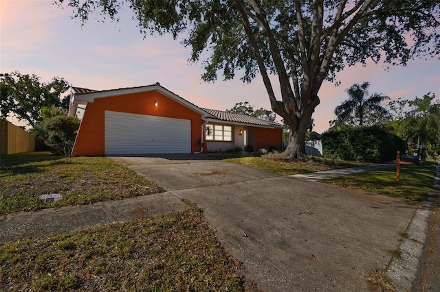 ranch-style home with a garage