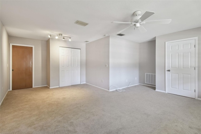 unfurnished bedroom with visible vents, baseboards, and carpet floors