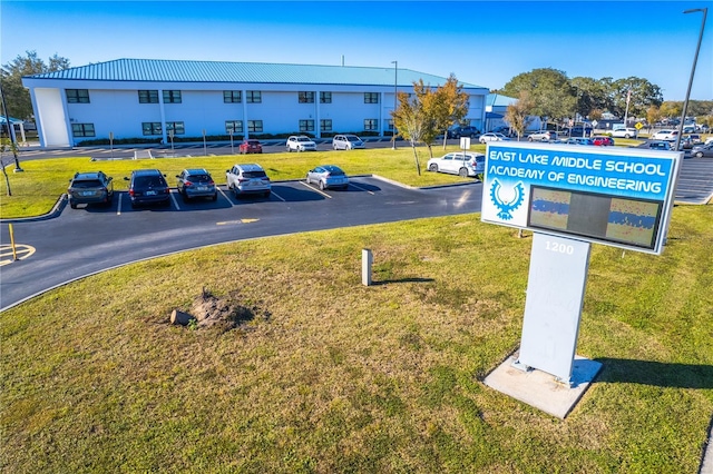 5211 Karlsburg Pl, Palm Harbor, FL 34685 - surrounding community featuring uncovered parking and a lawn