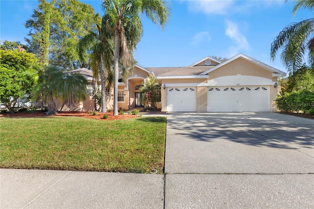 view of front facade with a garage and a front lawn