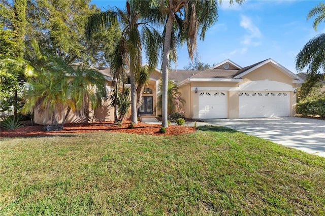 single story home featuring a front lawn and a garage