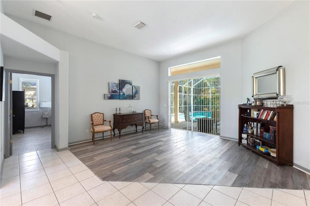 sitting room featuring light hardwood / wood-style flooring and plenty of natural light