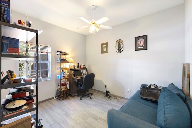 office space featuring ceiling fan and light hardwood / wood-style floors