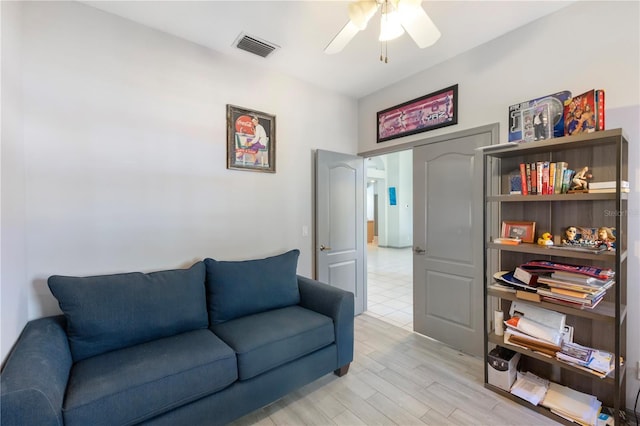5211 Karlsburg Pl, Palm Harbor, FL 34685 - living room with ceiling fan and light wood finished floors