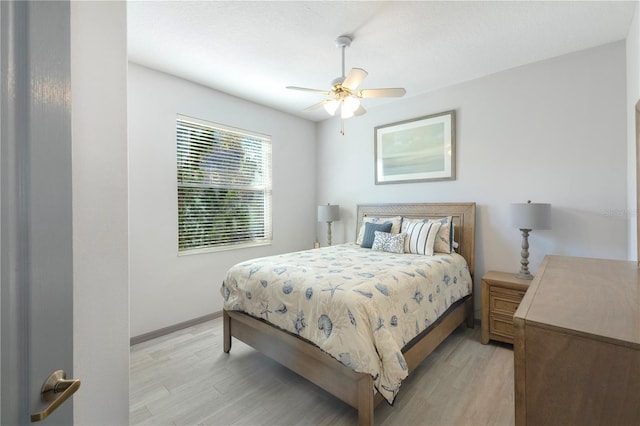 bedroom featuring light wood-type flooring and ceiling fan