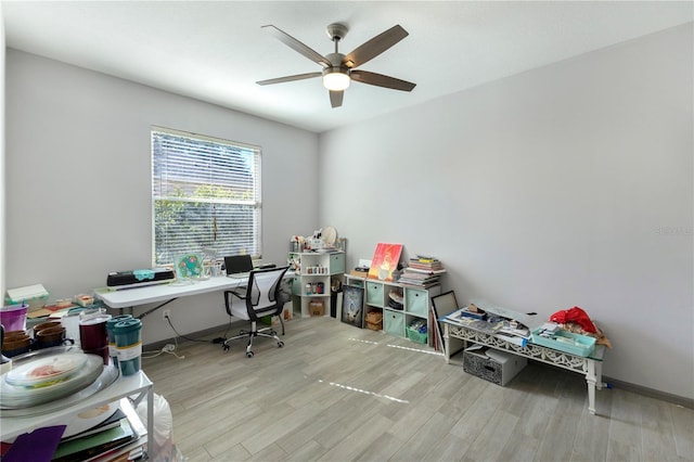 office space featuring light wood-type flooring and ceiling fan