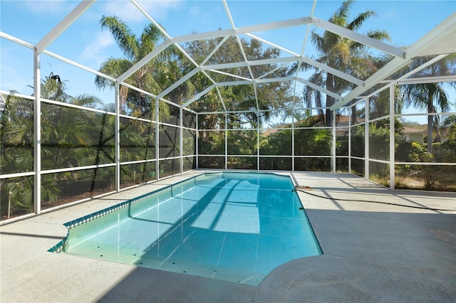 5211 Karlsburg Pl, Palm Harbor, FL 34685 - outdoor pool featuring a lanai and a patio