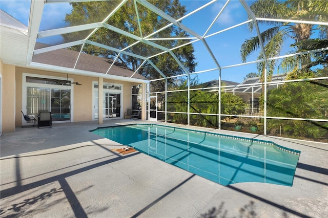 5211 Karlsburg Pl, Palm Harbor, FL 34685 - outdoor pool featuring a patio, a ceiling fan, and a lanai
