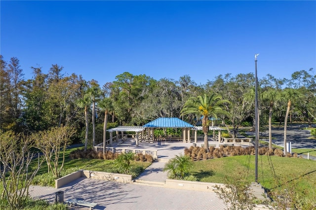 5211 Karlsburg Pl, Palm Harbor, FL 34685 - surrounding community featuring a gazebo, a lawn, and view of scattered trees