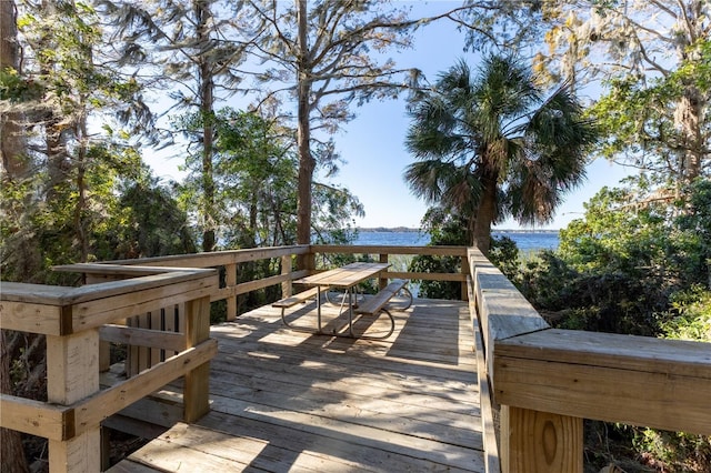 wooden deck featuring a water view