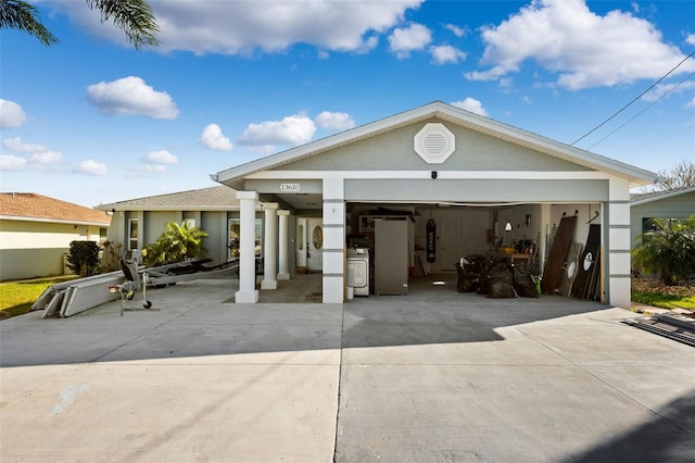 13610 Evelane Dr, Hudson, FL 34667 - view of front facade with driveway and stucco siding