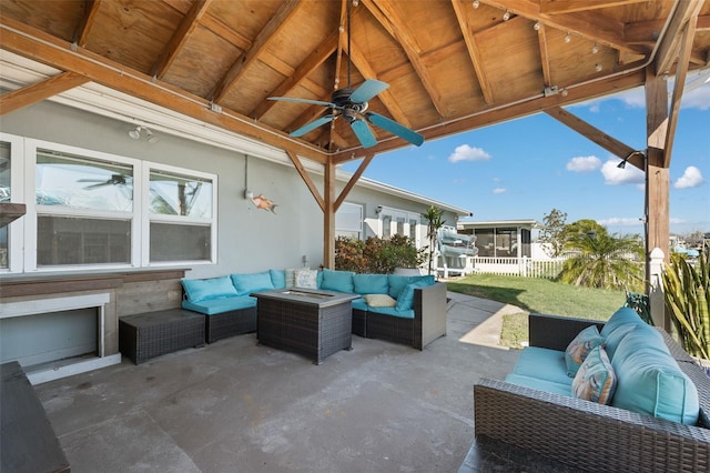 view of patio / terrace with an outdoor hangout area, ceiling fan, and a sunroom