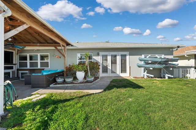 back of property with french doors, an outdoor hangout area, ceiling fan, a yard, and a patio area