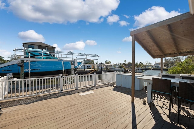 wooden terrace with a water view