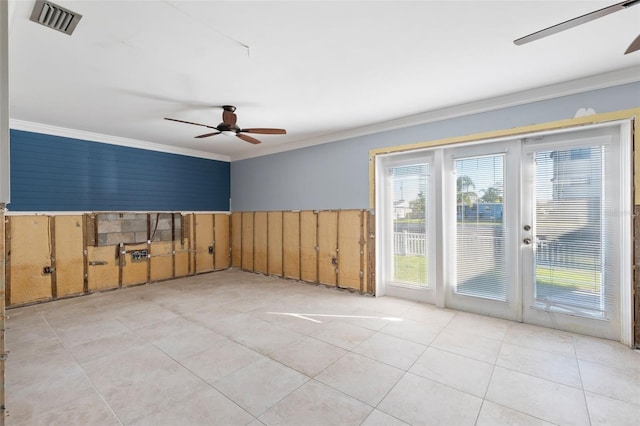 tiled spare room with ornamental molding