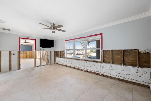 unfurnished room with ceiling fan and crown molding