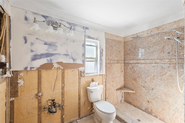 bathroom with toilet, walk in shower, and crown molding