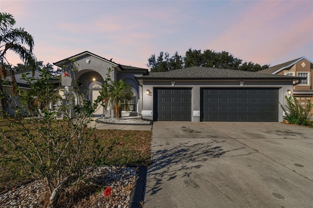 view of front of home with a garage