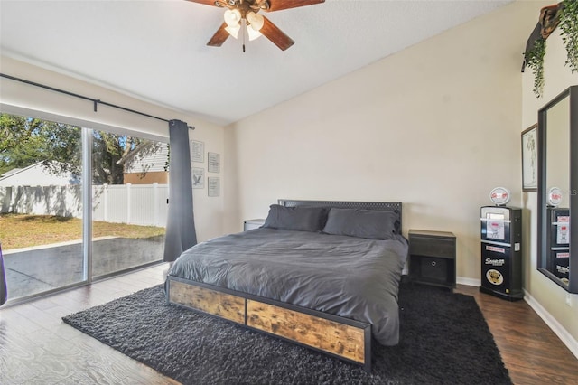 bedroom featuring access to outside, ceiling fan, lofted ceiling, and hardwood / wood-style flooring