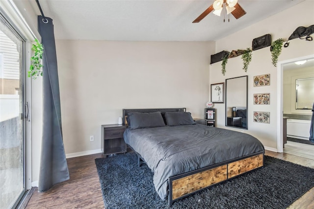 bedroom featuring ceiling fan, dark hardwood / wood-style flooring, and vaulted ceiling