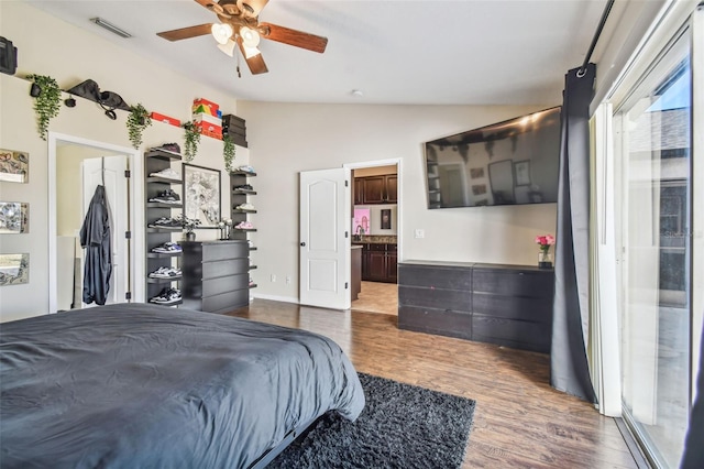 bedroom with hardwood / wood-style floors, vaulted ceiling, and ceiling fan