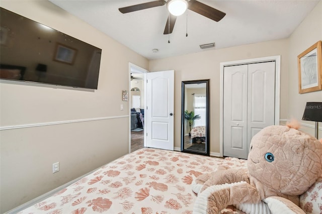 bedroom with ceiling fan, a closet, and carpet