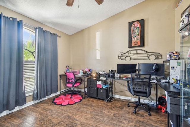 office featuring ceiling fan, dark wood-type flooring, and a textured ceiling