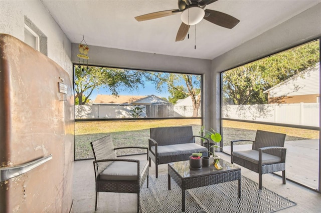 sunroom featuring ceiling fan