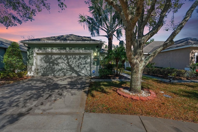 view of front of property with a garage