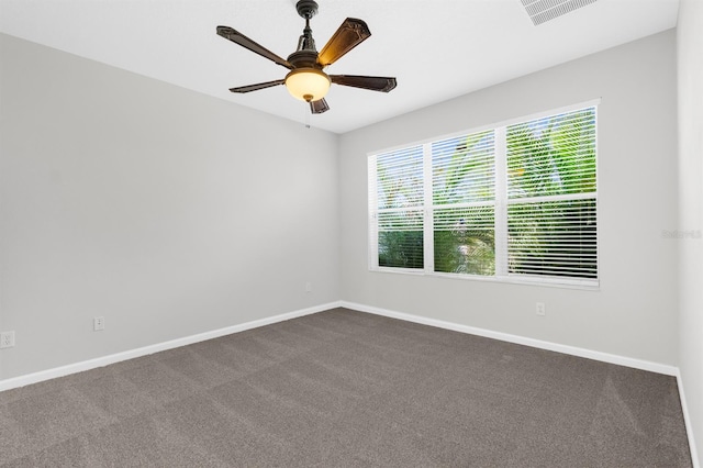 carpeted empty room featuring ceiling fan