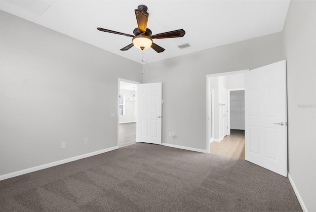 unfurnished bedroom with carpet flooring and ceiling fan