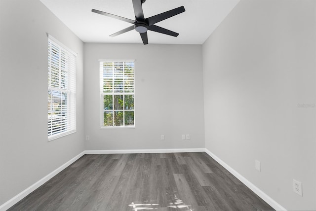 unfurnished room featuring dark hardwood / wood-style floors and ceiling fan