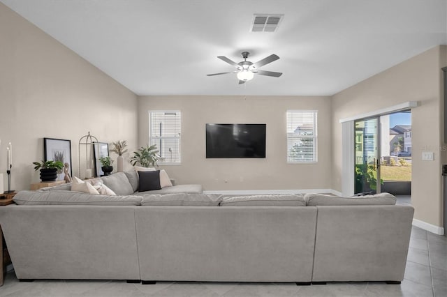 living room featuring ceiling fan and light tile patterned floors