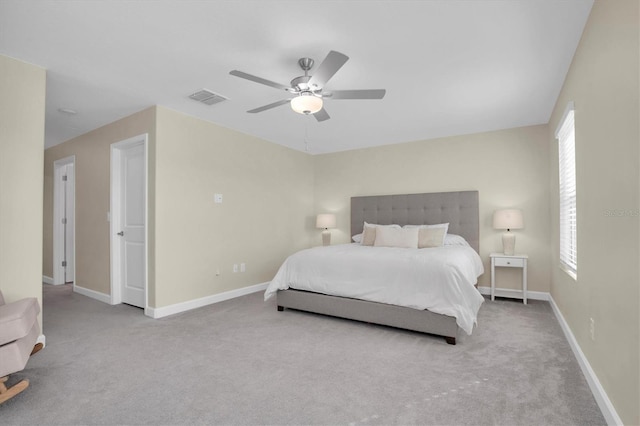 bedroom featuring ceiling fan and light colored carpet