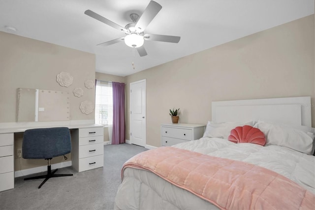 bedroom featuring ceiling fan and light carpet