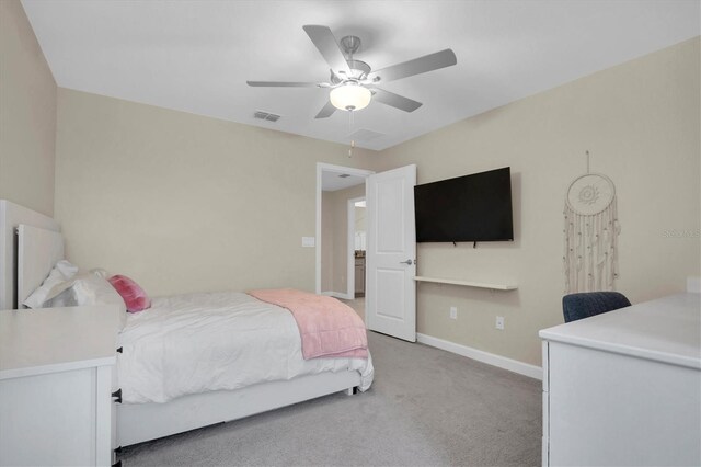 bedroom featuring ceiling fan and light colored carpet