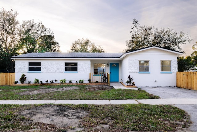 ranch-style home with a porch