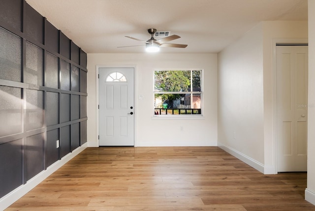 entryway with ceiling fan and light hardwood / wood-style flooring